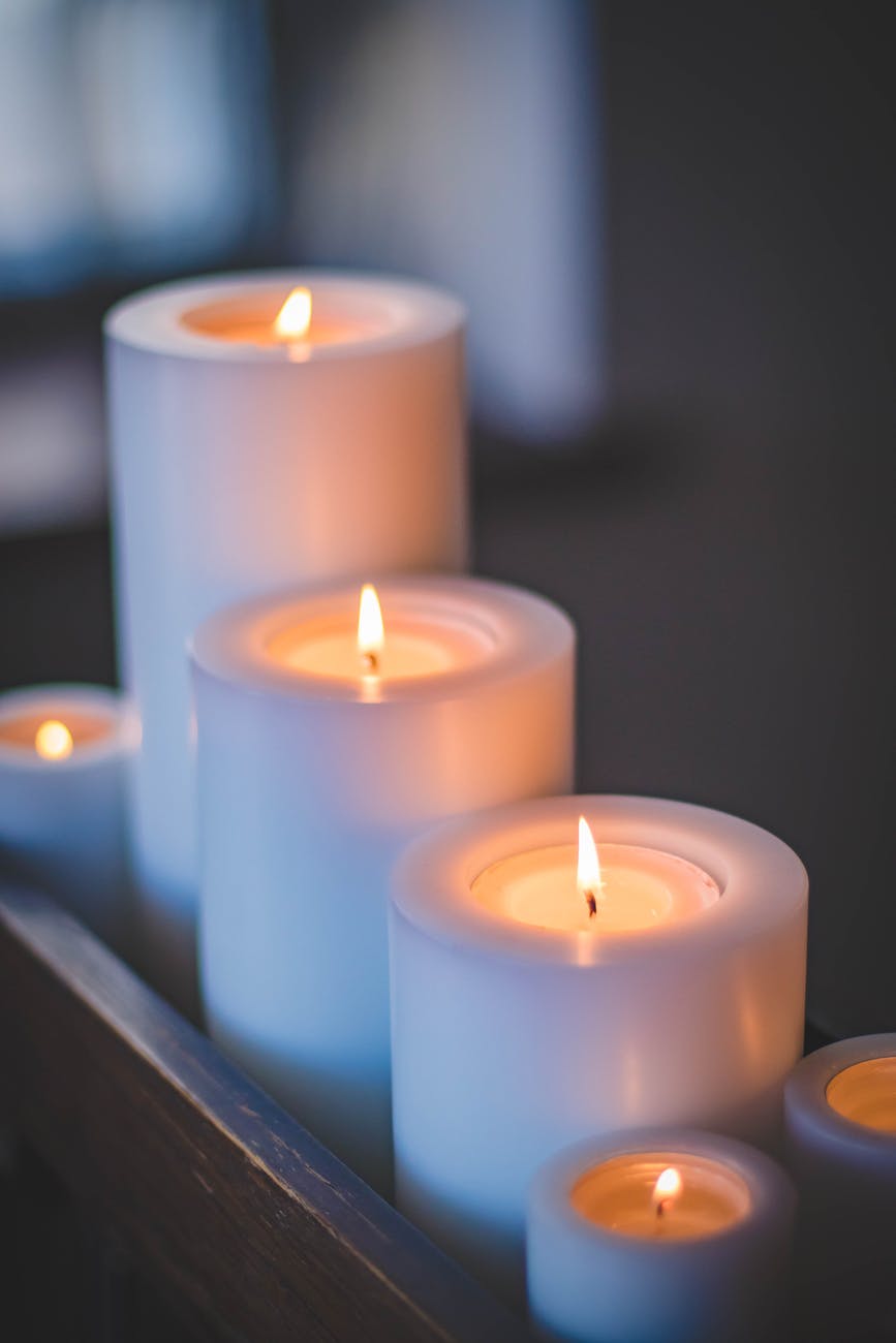 selective focus photography of candles - weekend home improvement projects